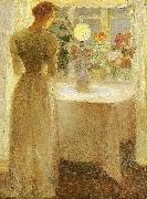 Anna Ancher ung pige foran en tandt lampe oil
